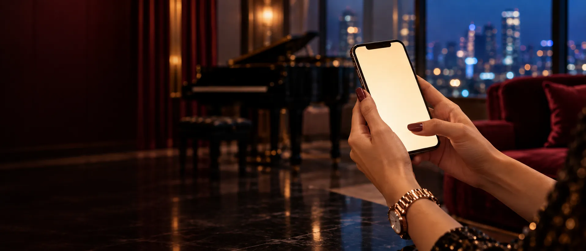 Hands holding a smartphone near a grand piano, standing in for a quick Here2Win Casino question and answer session